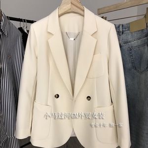 Double-breasted white blazer lined
